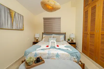 a bedroom with a bed with two towels on it at Charming 1 Bedroom in Tamarindo Dominicus With Pool in La Laguna