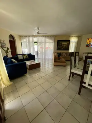 a living room with a couch and a table at Villa Michel in Laguna del Higüero