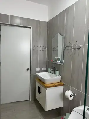 a bathroom with a sink and a mirror at CGM BLUE 1hab in Bayahibe