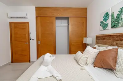 a bedroom with a large white bed with at Elegant 2 Bedroom Apartment with Pool in La Laguna