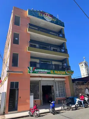 a group of motorcycles parked in front of a building at Hotel El Parque Constanza in Constanza
