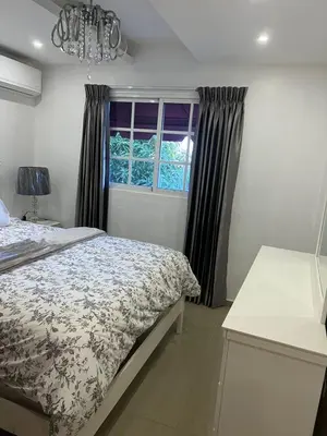 a bedroom with a bed and a window at Con in Santo Domingo