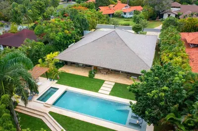 an aerial view of a house with a swimming pool at Villa Laguna, Lush Oasis In Casa De Campo in La Romana