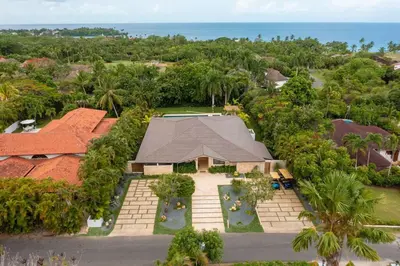 an aerial view of a house with a swimming pool at Villa Laguna, Lush Oasis In Casa De Campo in La Romana