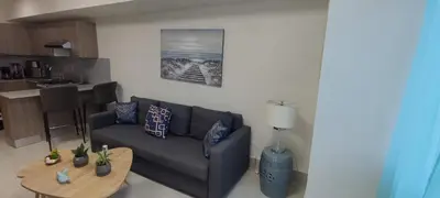 a living room with a couch and a table at Boca del Mar III, Boca Chica in Boca Chica