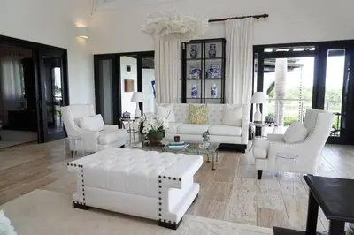 a white living room with white couches and chairs at Villa Alpes, Exquisite Retreat In Casa De Campo in La Romana