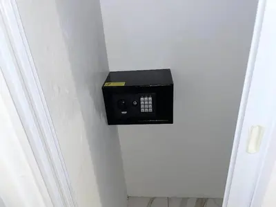a door with a black box on the wall at Level suites #2 platinum in Sosúa