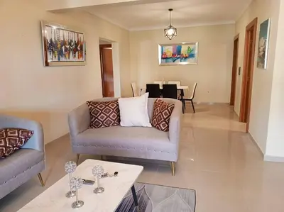 a living room with two couches and a table at Central Oasis Work or Explore the city in Santo Domingo