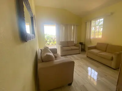 a living room with two chairs and a couch at Ático riomar segundo piso in Santa Bárbara de Samaná