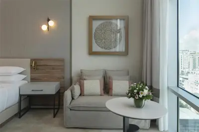 a living room with a couch and a bed and a table at Hyatt Centric Santo Domingo in Santo Domingo