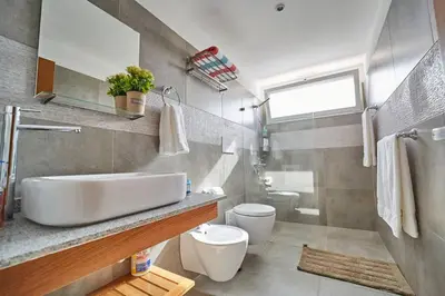 a bathroom with a sink and a toilet at New loft duplex with rooftop deck in La Laguna