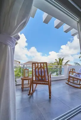 a room with two chairs on a balcony with a view at New loft duplex with rooftop deck in La Laguna