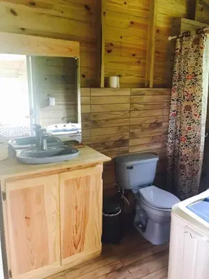 a bathroom with a sink and a toilet at Mango House Big air studio in Cabarete