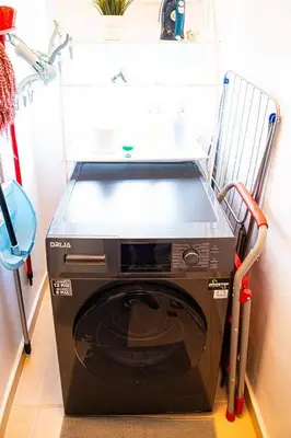 a washing machine is sitting in a room at Europeo tropical in La Javilla