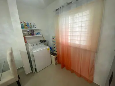 a small laundry room with a washing machine in it at Apartamento completo en Bayahibe in Bayahibe