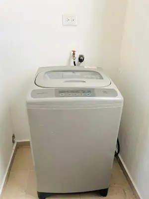 a washing machine with a sink on top of it at Luxury Aparment Bonao in Bonao
