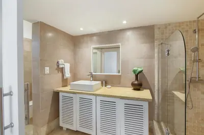a bathroom with a sink and a shower with a mirror at Cozy Private Family Villa at Casa de Campo - Pool, BBQ, Golf Cart in La Romana