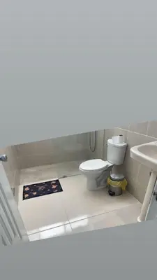 a bathroom with a toilet and a sink at Habitación económica in Santiago de los Caballeros