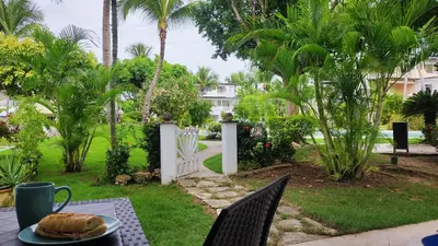 a table with a plate of food on it at Caribe Home Dominicus Oleandra 3 in La Laguna