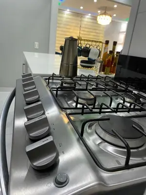 a gas stove top with a pot on top of it at Sol tropical in La Grúa
