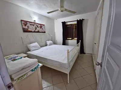 a small bedroom with a bed and a window at Apts dentro de Residencial Soficu Eden in La Laguna