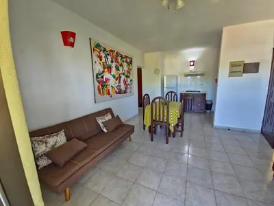 a living room with a couch and a dining room at Apts dentro de Residencial Soficu Eden in La Laguna