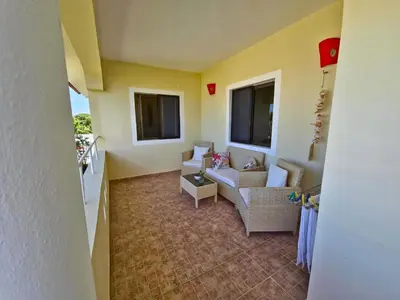 a living room with a couch and a table at Apts dentro de Residencial Soficu Eden in La Laguna