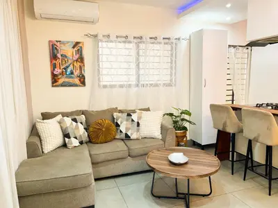 a living room with a couch and a table at Colonial leyton apartment in Santo Domingo