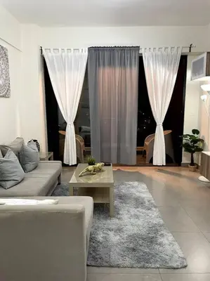 a living room with a couch and a table at Luxury Santo Domingo Tower Condo in Santo Domingo
