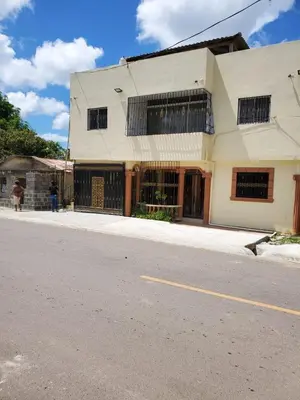 a building on the side of a street at The Loft Bayaguana in Bayaguana