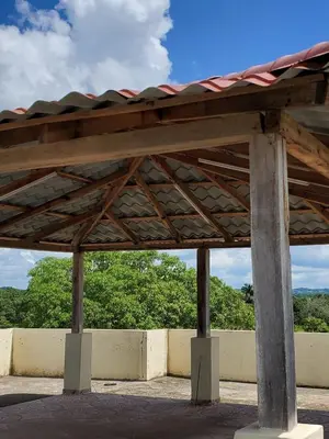 a pavilion with a roof on top of a building at The Loft Bayaguana in Bayaguana