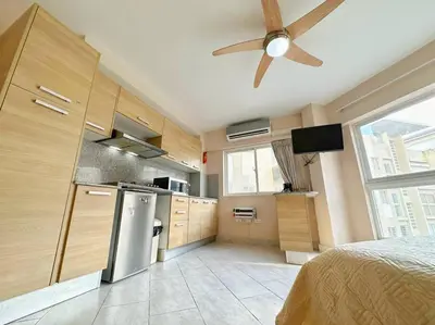 a kitchen with a ceiling fan in a room at BEST Studio, Pool & Gym, River view from terrace in Calero