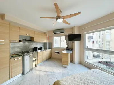 a kitchen with a ceiling fan in a room at BEST Studio, Pool & Gym, River view from terrace in Calero