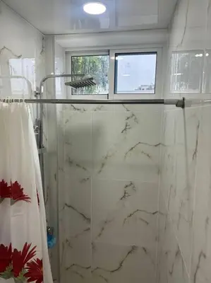 a bathroom with a marble shower with a glass door at Apartment, Close to the Bayahibe Beach in Bayahibe