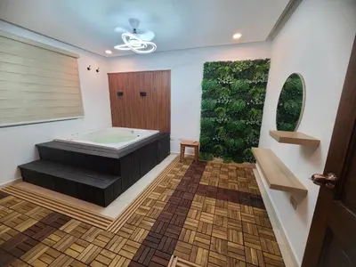 a bathroom with a tub and a green wall at Centrico con yacuzzi privado in Santiago de los Caballeros
