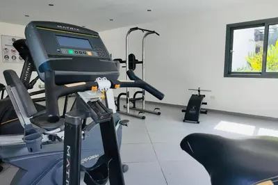 a room with a gym with a treadmill at Aligio Beachfront Resort & Spa in Las Terrenas