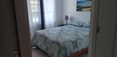 a bedroom with a bed with a quilt on it at Cabrera 6 in Cabrera