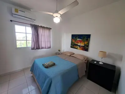 a bedroom with a bed with a blue blanket at Cabrera 6 in Cabrera
