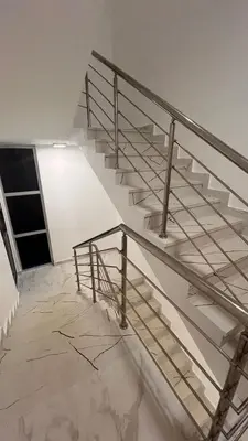a staircase in a building with a metal railing at Crown ll-3 Bedrooms-Pool-Close to everything! in San Felipe de Puerto Plata