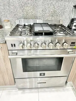 a stainless steel stove top oven in a kitchen at Luxury Penthouse DGM Resort at Boca del mar III, Boca Chica in Boca Chica