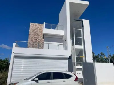 a white car parked in front of a house at Modern House in Santo Domingo Este in Juan López