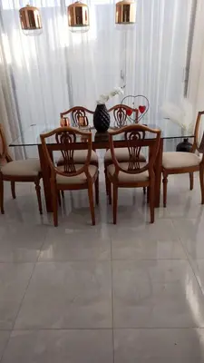 a dining room with a glass table and chairs at Gac 12 casa #1 in Los Paredones