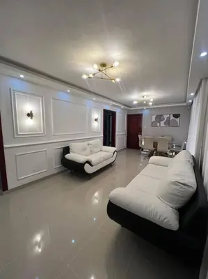 a living room with two beds and a couch at Encantador y lujoso apartamento in San Pedro de Macorís