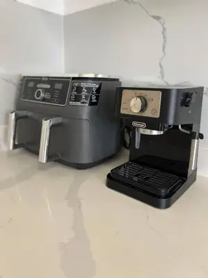a black coffee maker sitting on a counter at Encantador y lujoso apartamento in San Pedro de Macorís