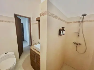 a bathroom with a toilet and a shower at Tropical Villa 4Bedroom 3Baths and Pool Near Beach in Las Terrenas