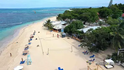 an aerial view of a beach with a volley ball court at Crown lll with Pool -3 Bedrooms close to Everything in Puerto Plata
