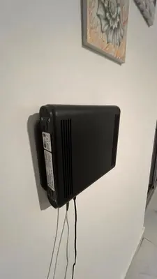 a black television hanging on a wall at Crown lll with Pool -3 Bedrooms close to Everything in Puerto Plata