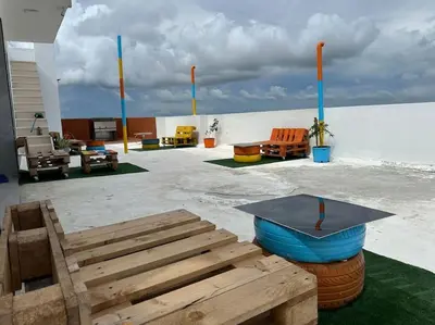 a patio with chairs and a blue bowl on a table at Apartment in Santo Domingo este in Juan López