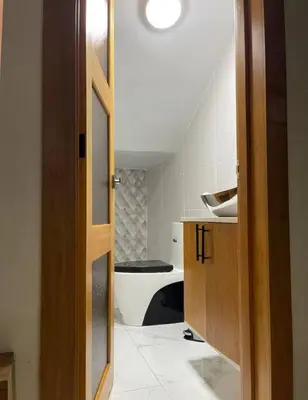 a bathroom with a sink and a toilet in it at Villa Naturaleza y confort in Santiago de los Caballeros