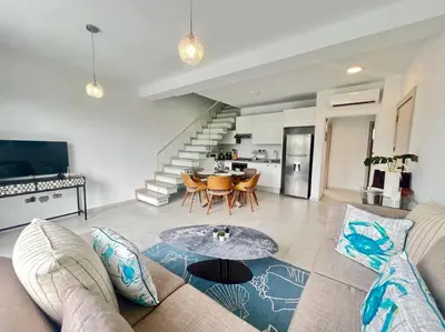 a living room with a couch and a table at AD-301 Ático Duplex Estrella Dominicus in La Laguna